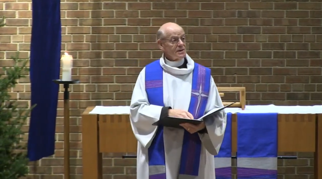 Pastor Glenn Seefeldt preaching in the Nativity Church sanctuary