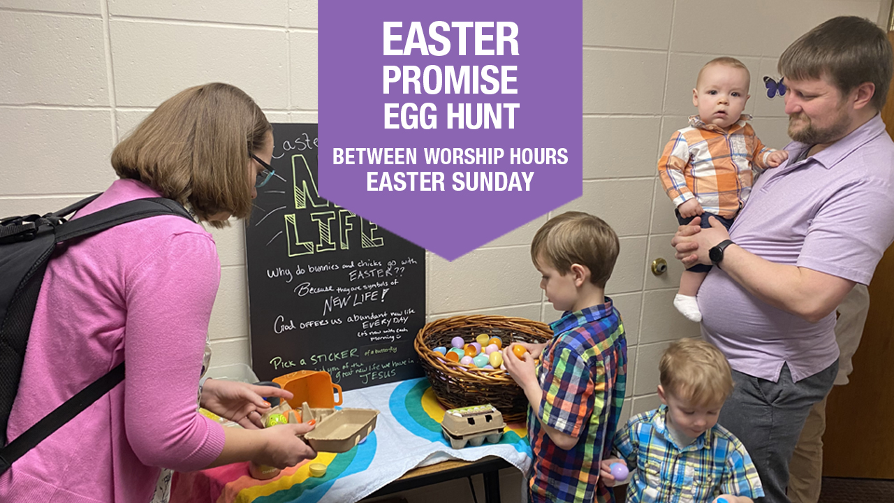 Mother, father, three children opening plastic Easter eggs with sign "Easter Promises Egg Hunt between worship hours Easter Sunday"