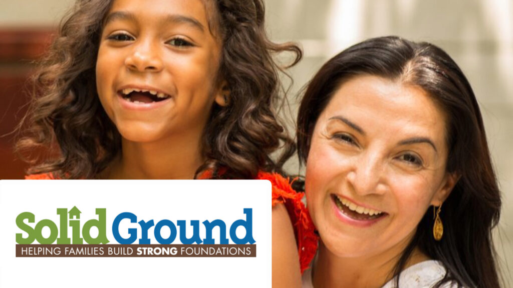Mother and daughter smiling with words Solid Ground: Helping Families Build Strong Foundations